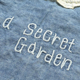 Denim Blouse with a Ruffled Collar